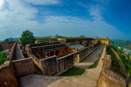 Amer, India - September 19, 2017: Unidentified people walking in the ruins of the palace and enjoying the gorgeous view of the old structure of the palace in Amber Fort, located in Amer, Rajasthan, India, fish eye effectのeditorial素材