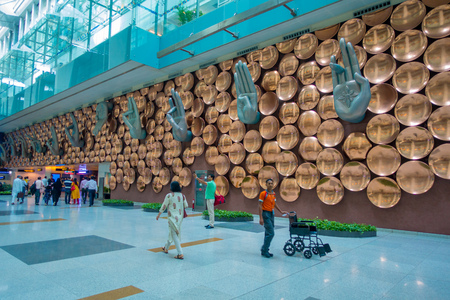 DELHI, INDIA - SEPTEMBER 19, 2017: Unidentifed people walking near of Mudras or Hand Gestures at Indira Gandhi International Airport in New Delhi. The airport is the busiest airport in the country since 2009のeditorial素材