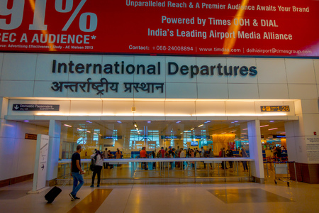 DELHI, INDIA - SEPTEMBER 19, 2017: Unidentified people walking to the Internacional departures in the International Airport of Delhiのeditorial素材