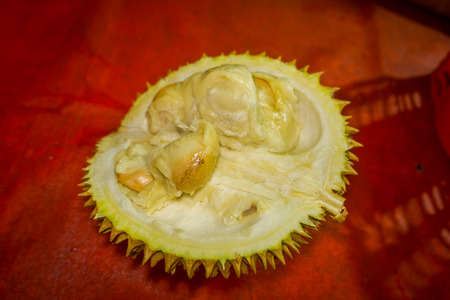 Close up keledang fruit seen from above, red background.の写真素材