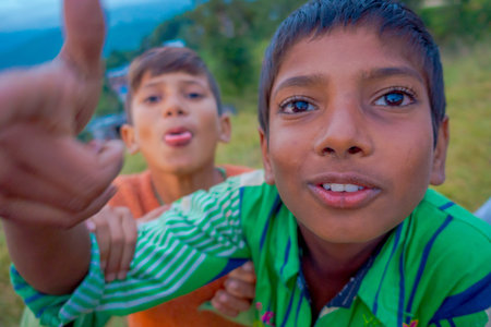 NAGARKOT, NEPAL OCTOBER 11, 2017: Close up of unidentified group of playful little children playing and enjoying time with their friends in Nagarkot Village, Central Region, Nepalのeditorial素材