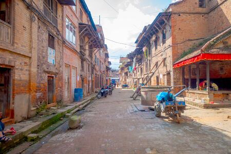 BHAKTAPUR, NEPAL - NOVEMBER 04, 2017: Blurred view of old and dirty street in a rustic town located in Bhaktapur, Nepal.のeditorial素材