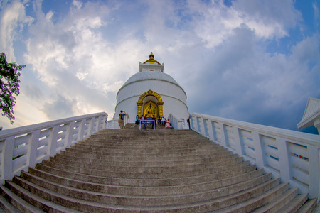 POKHARA, NEPAL, SEPTEMBER 04, 2017: Balanced on a narrow ridge high above Phewa Tal, the brilliant-white World Peace Pagoda in Pokhara is a massive Buddhist stupaのeditorial素材
