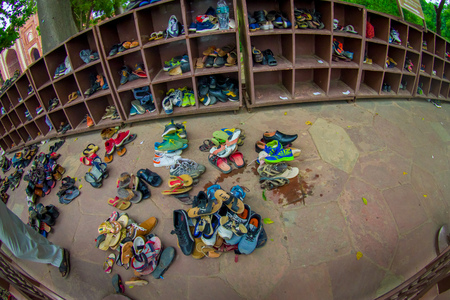 Agra, India - September 20, 2017: Shoes outside of a mosque at Taj Mahal, in the counter in the city of Agra, Indiaのeditorial素材