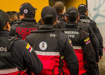 QUITO, ECUADOR - OCTOBER 11, 2017: Close up of back view of woman fireguard at the enter of the Atahualpa stadiumのeditorial素材