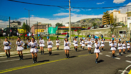 QUITO, ECUADOR - OCTOBER 23, 2017: Group of young school students girls in the march in the Quito Festivities paradeのeditorial素材