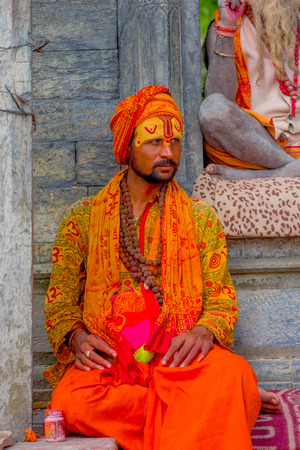 KATHMANDU, NEPAL OCTOBER 15, 2017: Close up of young Shaiva sadhu, holy man in Pashupatinath Temple with painted face in Nepalのeditorial素材