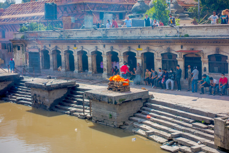 KATHMANDU, NEPAL OCTOBER 15, 2017: Aerial view of unidentified people watching the religious burning ritual at Pashupatina temple, Kthmandu.のeditorial素材