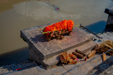 KATHMANDU, NEPAL OCTOBER 15, 2017: Aerial view of the body over a stoned table for religious burning ritual at Pashupatina temple, Kthmandu.のeditorial素材