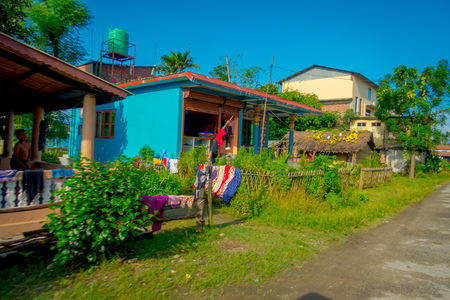 POKHARA, NEPAL OCTOBER 10, 2017: Old buildings in a Sauraha town close to a rice field in Sauraha, Nepalのeditorial素材