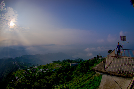 POKHARA, NEPAL, SEPTEMBER 04, 2017: Unidentified tourist at hilltop of the Sarangkot lookout point in the mountain to view Annapurna Range during sunrise at Sarangkot, Nepalのeditorial素材