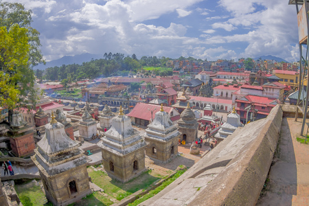 KATHMANDU, NEPAL OCTOBER 15, 2017: Beautiful landscape with some buildings where the Religious burning ritual at Pashupatina temple happen, in Kthmandu Nepal, fish eye effectのeditorial素材