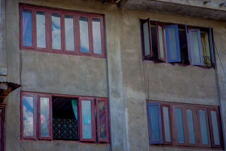 KATHMANDU, NEPAL OCTOBER 15, 2017: A building facade with brick wall of the historical building near Patan Durbar Square, Kathmandu, Nepalのeditorial素材