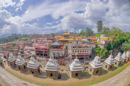 KATHMANDU, NEPAL OCTOBER 15, 2017: Beautiful landscape with some buildings where the Religious burning ritual at Pashupatina temple happen, in Kthmandu Nepal, fish eye effectのeditorial素材