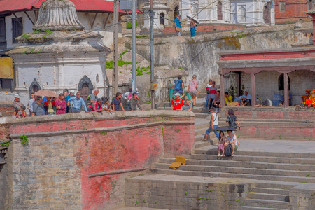 KATHMANDU, NEPAL OCTOBER 15, 2017: Unidentified people watching the Religious burning ritual at Pashupatina temple, Kthmanduのeditorial素材