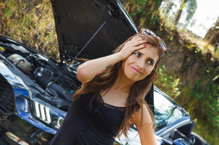 Close up of worried woman wearing sunglases in her head, black t-shirt and jeans, having a problem...