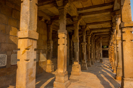 Agra, India - September 20, 2017: Columns with stone carving in courtyard of Quwwat-Ul-Islam mosque, Qutub Minar complex, Delhi, Indiaのeditorial素材