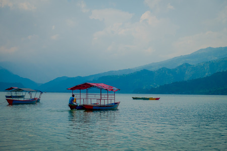 POKHARA, NEPAL - SEPTEMBER 04, 2017: Unidentified people enjoying a trip in ab oat in the Phewa tal-lake in Pokhara, Nepalのeditorial素材