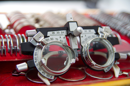 Close up of a phoropter inside the optical over a showcase in a blurred background