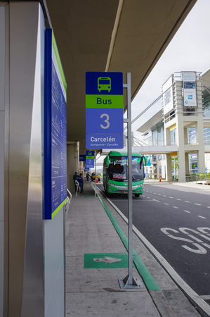 Quito, Ecuador - November 23 2017: Informative sign at outdoors and bus parked waiting for passengers in the Mariscal Sucre International Airport of the city of Quitoのeditorial素材