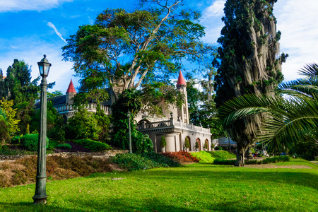 Beautiful outdoor view of the garden with a gorgeous view of gothic medieval Castle Museum behind in Medellin, Colombia, South Americaの写真素材