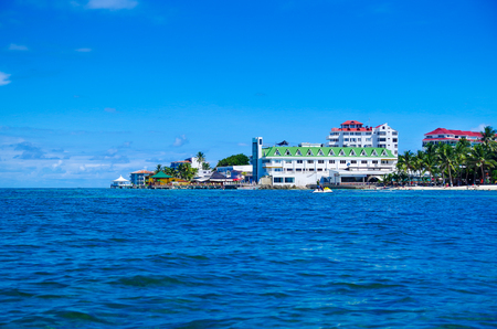 SAN ANDRES, COLOMBIA - OCTOBER 21, 2017: Beautiful view of some buildings in the horizont with a gorgeos blue water in San Andres Island during a sunny day in San Andres, Colombiaのeditorial素材