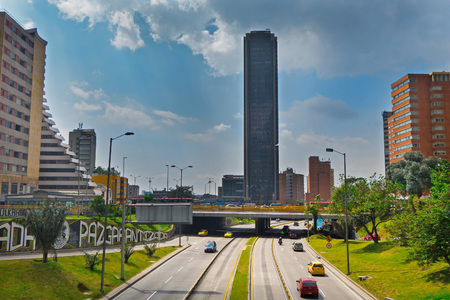 BOGOTA, COLOMBIA - OCTOBER, 22, 2017: Beautiful outdoor view of the Colpatria Tower, Transmilenio with some cars in the highway in Bogotaのeditorial素材