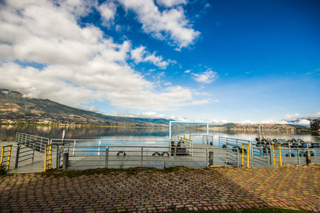 Beautiful view of the pier in San Pablo lake in a beautiful day with blue sky and some cloudsの写真素材