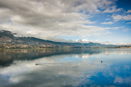 Beautiful view of Imbabura volcano and San Pablo lake in the middle of the valley of the province of the same nameの写真素材