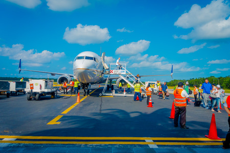 COZUMEL, MEXICO - NOVEMBER 12, 2017: Unidentified people landing from the airplane on the runway of Cozumel International Airport in Mexicoのeditorial素材