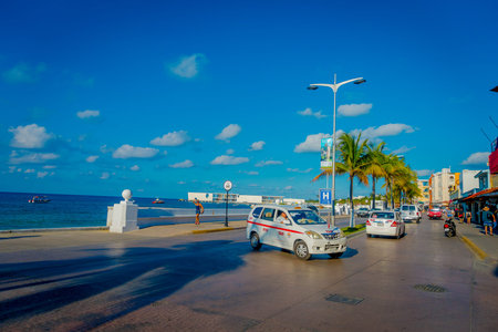 COZUMEL, MEXICO - NOVEMBER 09, 2017: Beautiful outdoor view of tourists enjoying the city of Cozumel, surrounding of cars of locals in downtownのeditorial素材