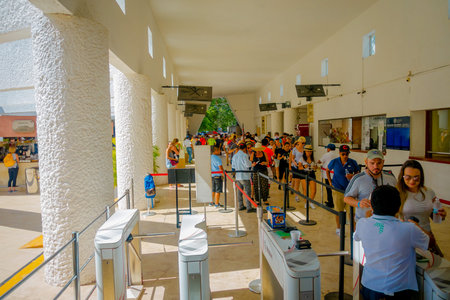 CHICHEN ITZA, MEXICO - NOVEMBER 12, 2017: Unidentified tourists wait in a queue for buy tickets to...