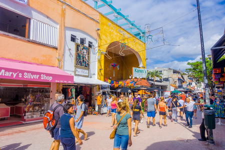 PLAYA DEL CARMEN, MEXICO - JANUARY 10, 2017: Crowd of tourists along city streets. Approximately 2 million tourists per year visit Playa del Carmen and its surroundingsのeditorial素材