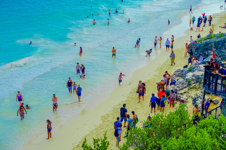 TULUM, MEXICO - JANUARY 10, 2018: Beautiful above view of unidentified enjoying the beautiful view close to the Mayan Ruins of Tulum Besides Caribbean Sea. Riviera Maya, Traveling Americaのeditorial素材