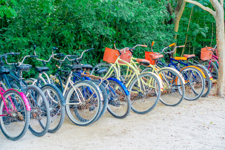 TULUM, MEXICO - JANUARY 10, 2018: Outdoor view of some bikes parked in a row in the enter of Mayan ruins of Tulum in Quintana Roo,Yucatan Peninsula, Mexicoのeditorial素材