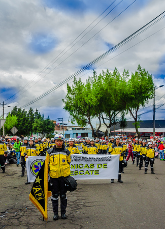 Quito, Ecuador - January 31, 2018: Outdoor view of unidentified students of hospitalary atentions and emergency, holding in their hands an informative banner during a festival parade in Quito, Ecuadorのeditorial素材