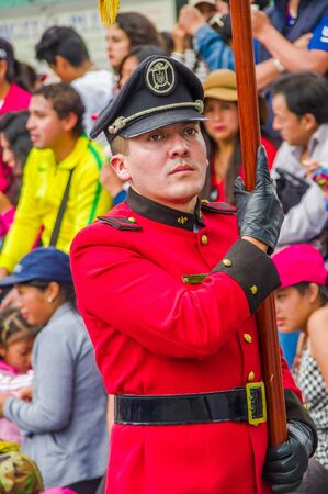 Quito, Ecuador - January 31, 2018: Portrait vief of unidentified firefighter man wearing a red equipment, marching in the streets during a parade in Quitoのeditorial素材