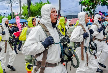 Quito, Ecuador - January 31, 2018: Unidentified group of firefighters team wearing an equipment of protection, walking in the streets during a parade in Quitoのeditorial素材