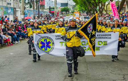 Quito, Ecuador - January 31, 2018: Outdoor view of unidentified students of hospitalary atentions and emergency, holding in their hands an informative banner during a festival parade in Quito, Ecuadorのeditorial素材