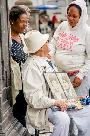 QUITO, ECUADOR, JANUARY 11, 2018: Unidentified people talking with the father of the Restrepo brothers missed 30 years ago in the city of Quito, Ecuadorのeditorial素材