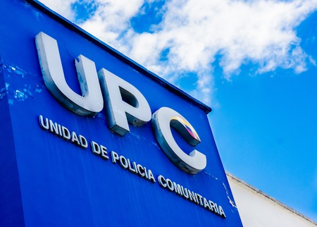Quito, Ecuador - January 02, 2017: Outdoor view of a sign words of UPC, comunitary police unit , with the logo in the wall of a building, located in the city of Quito, Ecuadorのeditorial素材