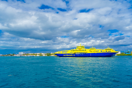 ISLA MUJERES, MEXICO, JANUARY 10, 2018: Outdoor view of huge boat of color blue and yellow sailing in the waters close to the Isla Mujeres . The island is some 7 kilometres long and 650 metres wideのeditorial素材