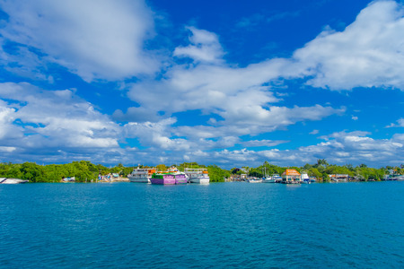ISLA MUJERES, MEXICO, JANUARY 10, 2018: Astonishing outdoor view of many ships and some buildings in the horizont in the beach Isla Mujeres in caribbean sea, with a turquoise water in Mexicoのeditorial素材