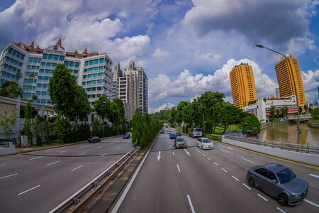 SINGAPORE, SINGAPORE - JANUARY 30. 2018: Outdoor view of park hotel building complex and downtown at Kallang neighborhood with a some cars in the streets in Singapore, fish eye effectのeditorial素材