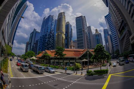 SINGAPORE, SINGAPORE - JANUARY 30. 2018: Beautiful outdoor view of public residential condominium building complex and downtown skylines at Kallang neighborhood with some cars in the streets of Singapore, fish eye effectのeditorial素材