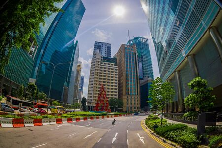 SINGAPORE, SINGAPORE - JANUARY 30. 2018: Outdoor view of residential buildings complex and downtown skylines at Kallang neighborhood with some cars in the streets of Singapore, fish eye effectのeditorial素材