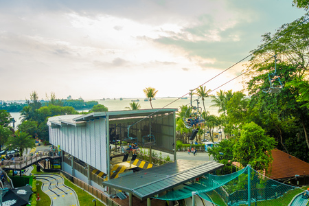 SINGAPORE, SINGAPORE - JANUARY 30, 2018: Outdoor view of unidentified people wnjoying the ride at Singapore Sentosa Cable Car and Skyline Luge, in a beautiful sunset in Singaporeのeditorial素材