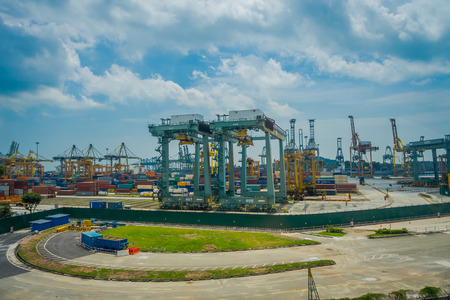 SINGAPORE, SINGAPORE - JANUARY 30, 2018: Outdoor view of some metallic structures at the Port of Singapore. Ship-to-shore STS gantry cranes at shipping yard. Sentosa Islandのeditorial素材