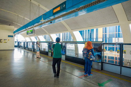 SINGAPORE, SINGAPORE - JANUARY 30, 2018: Unidentified people waiting for the train, Mass Rapid...