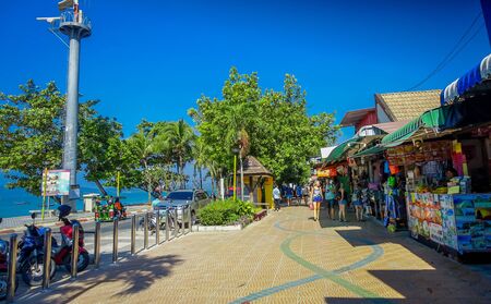 AO NANG, THAILAND - MARCH 19, 2018: Tourist shopping at local shops at Ao Nang beach front market. Ao Nang beach front market is one of famous spot for shoppingのeditorial素材